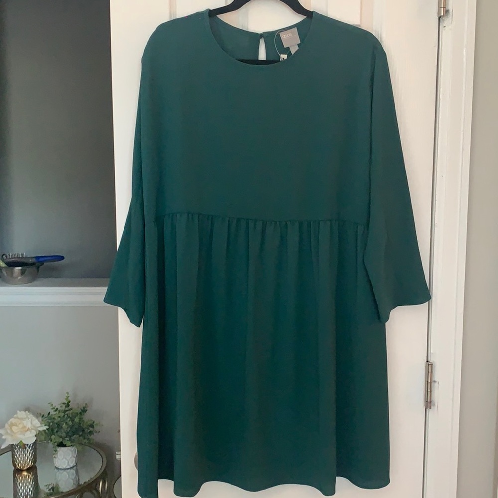 Long sleeve smock dress in forest green color. New